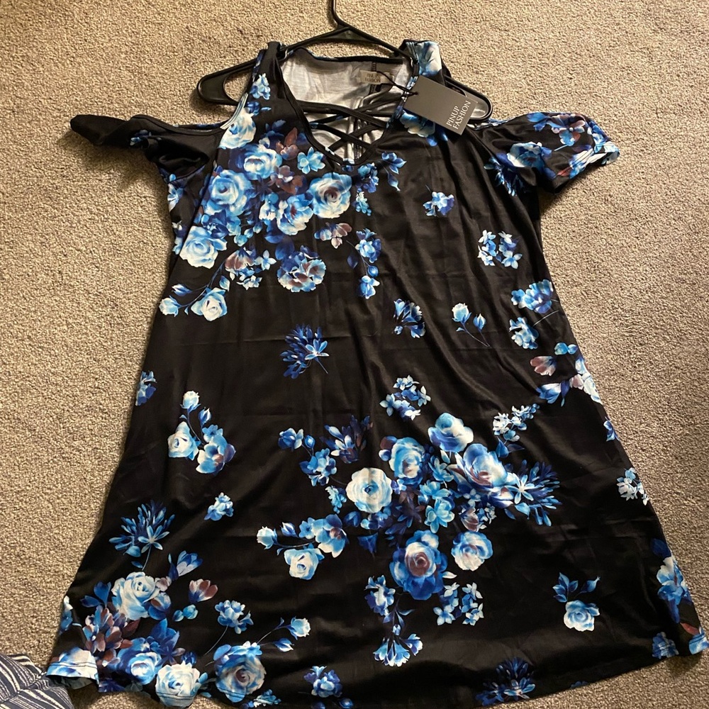 Never been worn. Blue and black cold shoulder. It’s too short for me. I am 5’7.